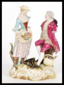 A Meissen figurine group of a man and companion drinking wine, emblematic of Taste, on scroll-