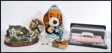 A good collection of Elvis Presley collectable Franklin Mint items to include CD's, a scale model of