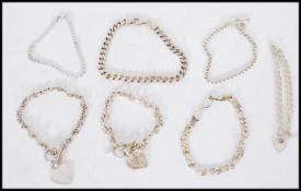 A selection of silver chain necklaces with heart clasps. Total weight 75g.