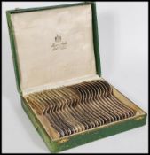 A 875 purity silver set of cutlery consisting of twelve table forks and spoons. Each stamped 84 (/