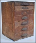 A selection of 20th century watch glasses of various sizes in a wooden case having graduating