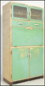 A mid century, circa 1950's upright kitchen dresser in blue colourway having cupboards and drawers