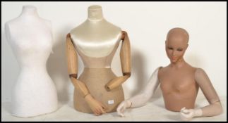 A collection of vintage 20th century shop mannequin - torso's. Half body with articulated arms,