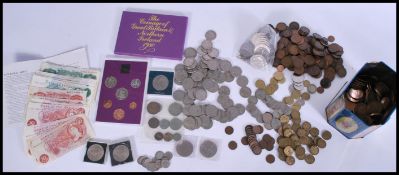 A collection of 20th Century pre and post decimal coins and notes, to include several £1 notes, 10
