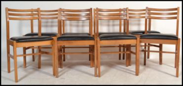 A set of 8 mid century ( ex RAF / Air Ministry ) marked oak dining chairs. Raised on squared legs