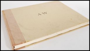 A large folio book by Richard Merryman about Andrew Wyeth featuring large coloured prints