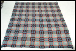 A vintage 20th Century traditional Welsh woollen carthen type fringed blanket with geometric