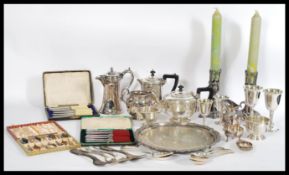 A selection of silver plated items to include based EPNS teaspoons, two cased sets of butter