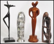A group of four vintage 20th century statues to include Art Deco style dancer figure, Aluminium
