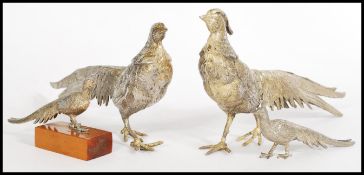 Two pairs of vintage 20th century silver plated brace pairs of pheasants one being a pair of typical