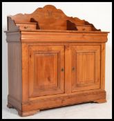 A 20th century French cherry wood buffet sideboard comprising gallery top over drawers and cupboards