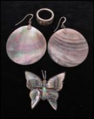 A signed Mexican silver butterfly brooch  together with a white metal abalone set ring and earrings.
