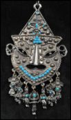 A 1970s oversized silver tone pendant necklace having a huge Mexican folk art pendant set with