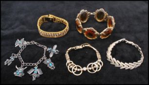 A collection of vintage bracelets to include a signed rhinestone Coro bracelet and a signed