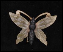 A circa late 19th century medium Art Nouveau French carved horn butterfly brooch. Measures 1 3/4