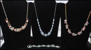 A 1940s rhodium plated and paste set necklace together with 1940s  gold-tone AB rhinestone flower