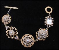 A vintage faux pearl and rhinestone bracelet having a toggle clasp. Measures 8 inches.