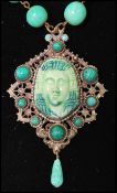 A 1930s Czech Neiger brothers Egyptian revival pendant necklace, having peaking glass and fretwork