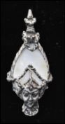 A 1950s Selro Selini Asian Siam face silver tone brooch pin set with mother of pearl. Measures 2