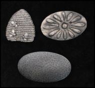 Three vintage pewter brooches, one signed Oska. A beehive signed Sheridan Fine Pewter and one