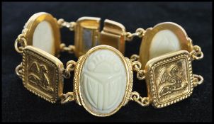 A 1950's goldtone good quality metal Egyptian revival bracelet having thermoset scarab cabochon