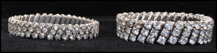 Two 1950s stretch rhinestone bangles one marked Made in USA the other Made in Japan. Unstretched