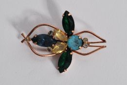A 1940's sterling silver vermiel signed Coro bug brooch set with coloured rhinestones. Measures
