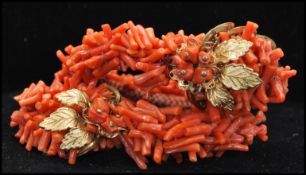 A vintage Frank Hess / Miriam Haskell spezzati coral coil bracelet having gold tone filigree and