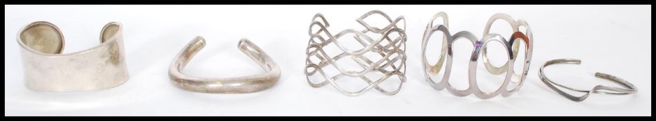 A selection of silver bangle cuffs to include pier