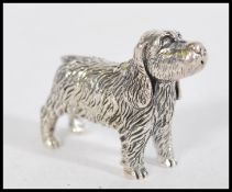 A stamped STERLING silver dog figurine. Weight 20.
