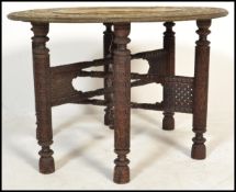A 19th century Anglo- Colonial brass topped table