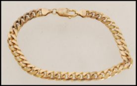 A 20th century stamped 9ct gold bracelet having fl