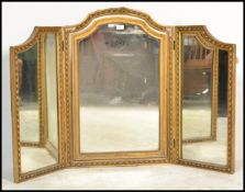 An early 20th Century Edwardian gilt triptech mirr