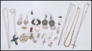 A collection of silver jewellery to include pendan