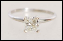 An 18ct white gold diamond solitaire ring set with