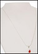 A stamped 925 silver pendant necklace strung with