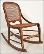 An early 20th century child's wooden rocking chair