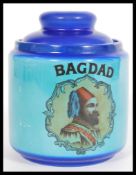 A vintage 20th century blue tobacco jar reading Ba