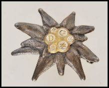 A 20th century white and yellow metal edelweiss ba