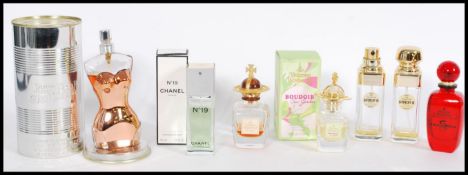 A collection of perfume bottles to include Jean Pa