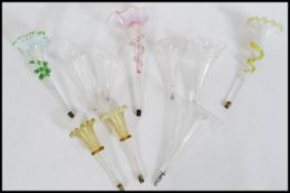 A collection of glass epergne trumpets in the form