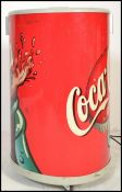 A retro 20th century Coca-Cola advertising fridge
