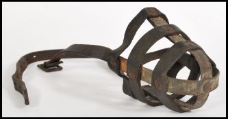 A 19th century leather bear bating muzzle.