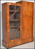 A 1930's Art Deco walnut bureau bookcase. The disp