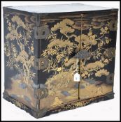 A JAPANESE CHINOSERIE 19TH CENTURY BLACK LACQUER CABINET