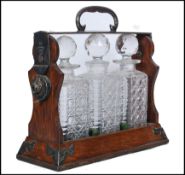 19TH CENTURY BETJEMANNS SILVER PLATED OAK 3 DECANTER TANTALUS