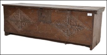 A 17TH CENTURY CARVED OAK SWORD BOX - COFFER CHEST
