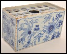 18TH CENTURY ENGLISH DELFT BLUE AND WHITE FLOWER BRICK