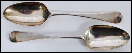 TWO 18TH CENTURY ROGER HARE SILVER SHELL BACK HANOVERIAN SPOONS.