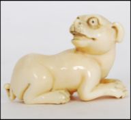 RARE MEIJI PERIOD IVORY CARVED NETSUKE OF A CROUCHING DOG